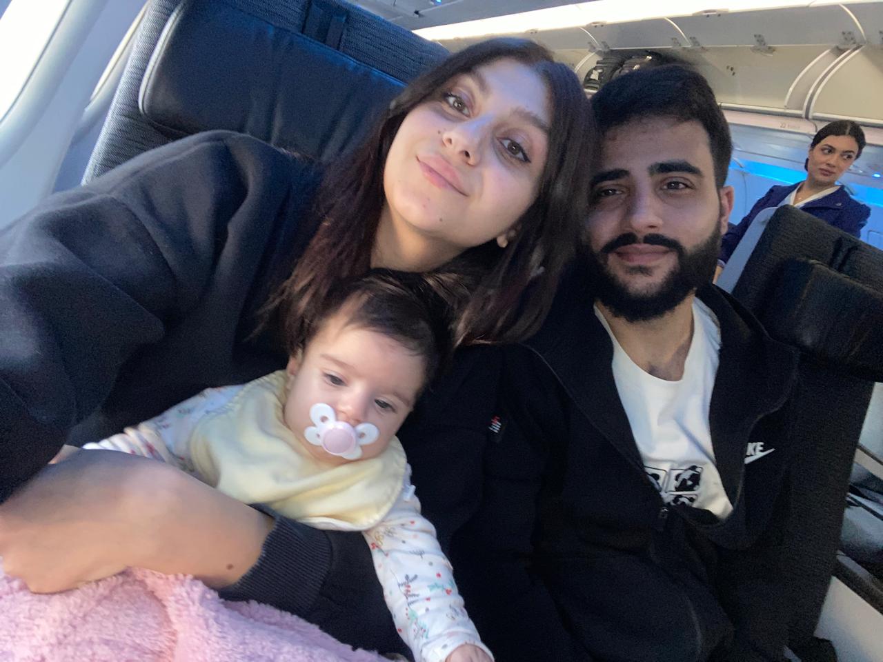 Christina, her partner, and Reina on the plane leaving Lebanon